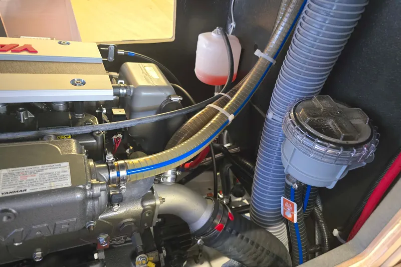 Slide: The Image of Engine compartment of a 2022 Beneteau Oceanis 40.1 sailboat, featuring Yanmar components. - 11