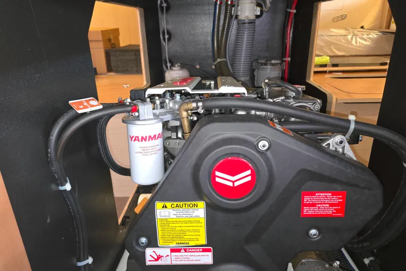 Slide: The Image of Engine compartment of a 2022 Beneteau Oceanis 40.1 sailboat, featuring a Yanmar engine. - 12