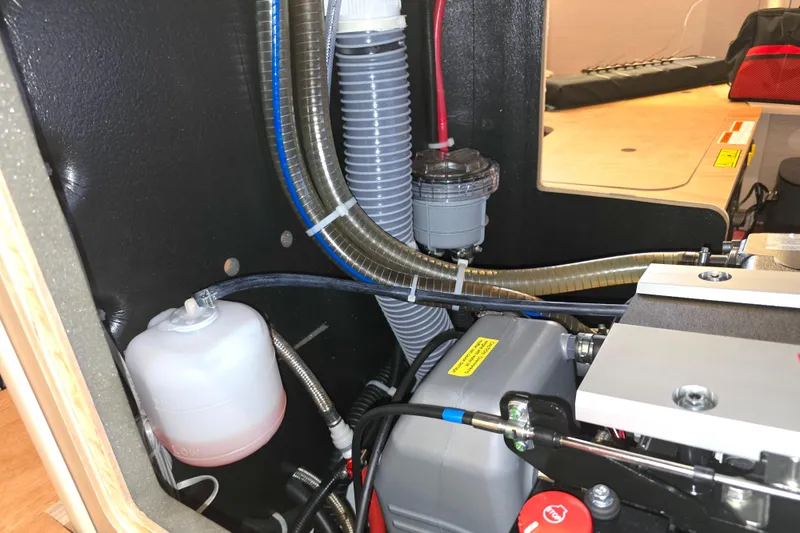 Slide: The Image of Engine compartment of 2022 Beneteau Oceanis 40.1 yacht, showcasing hoses and components. - 15