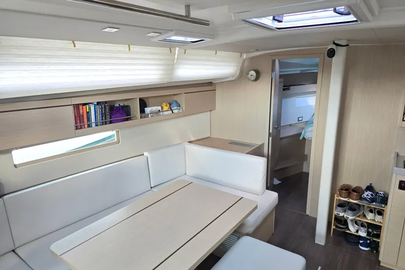 Slide: The Image of Interior of 2022 Beneteau Oceanis 40.1 yacht, featuring modern seating and storage. - 5