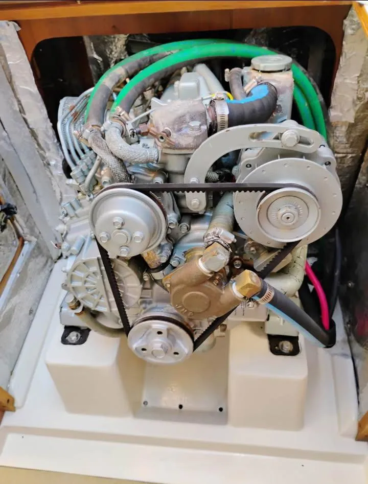 Slide: The Image of Catalina 34 Mark II 2002 engine with belts and hoses in a compact compartment. - 12
