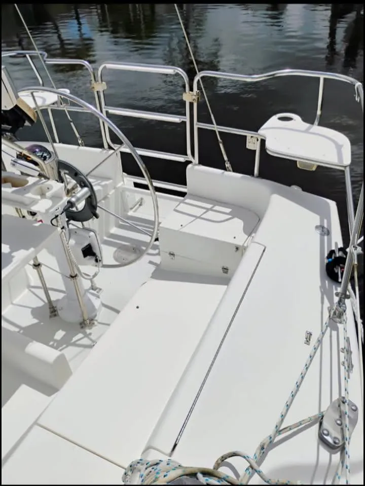 Slide: The Image of 2002 Catalina 34 Mark II sailboat cockpit with steering wheel and seating. - 4