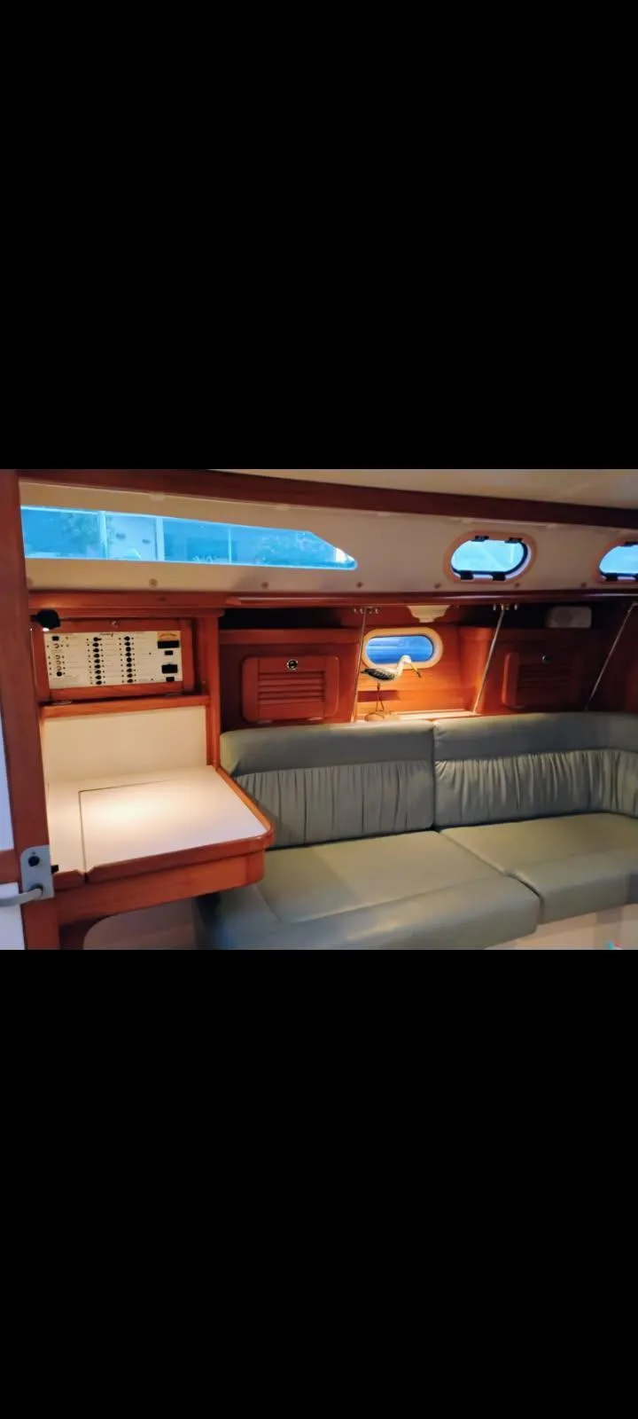 Slide: The Image of Interior of 2002 Catalina 34 Mark II sailboat with seating and control panel. - 6