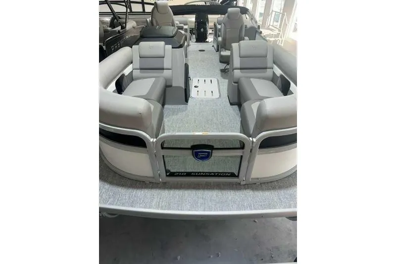 Slide: The Image of 2024 Premier 210 Sunsation RF pontoon boat with spacious seating and modern design. - 3