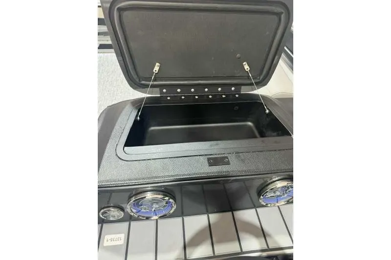 Slide: The Image of Open storage compartment on 2024 Premier 210 Sunsation RF boat. - 6