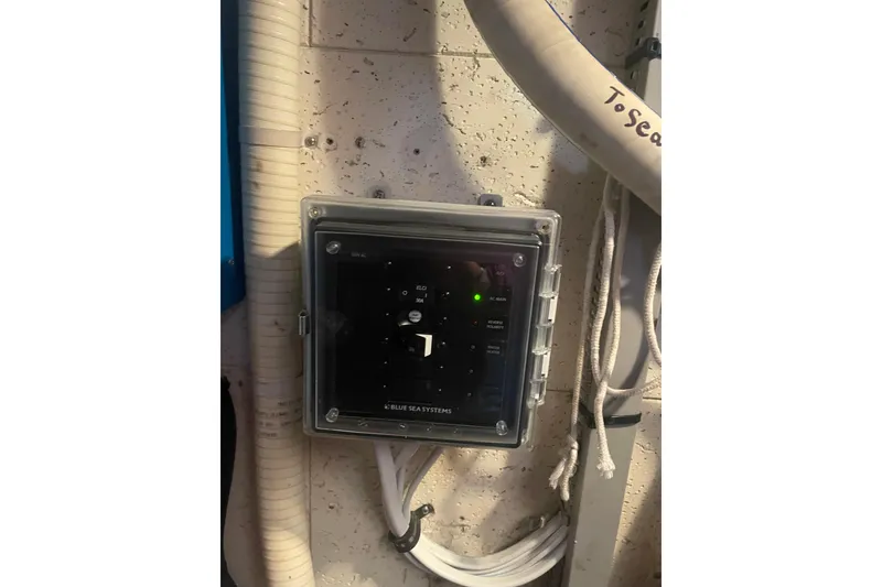 Slide: The Image of Electrical panel on 1985 Ocean Alexander 38 Double Cabin boat, featuring Blue Sea Systems. - 26