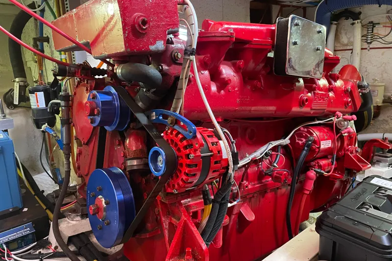 Slide: The Image of Engine room of 1985 Ocean Alexander 38 Double Cabin with red engine components. - 32