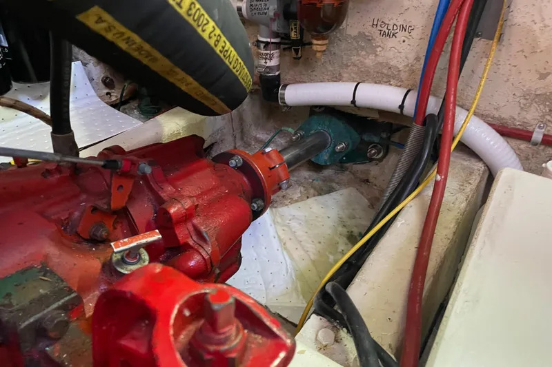 Slide: The Image of Engine compartment of a 1985 Ocean Alexander 38 Double Cabin with visible components and wiring. - 34