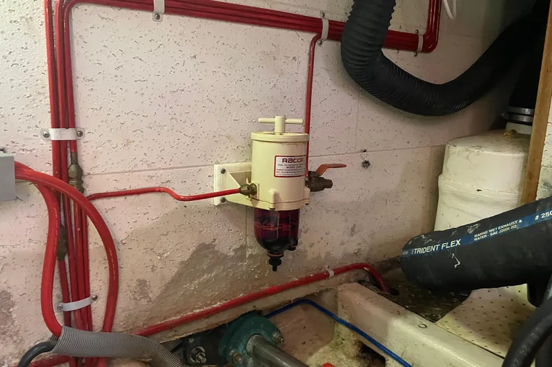 Slide: The Image of Engine room of 1985 Ocean Alexander 38 Double Cabin with Racor fuel filter system. - 36