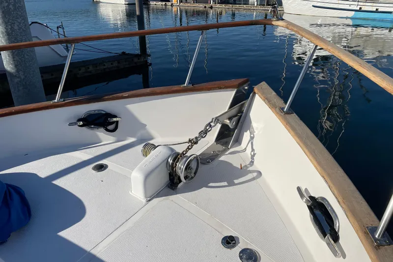 Slide: The Image of Bow of 1985 Ocean Alexander 38 Double Cabin with anchor chain and winch. - 4