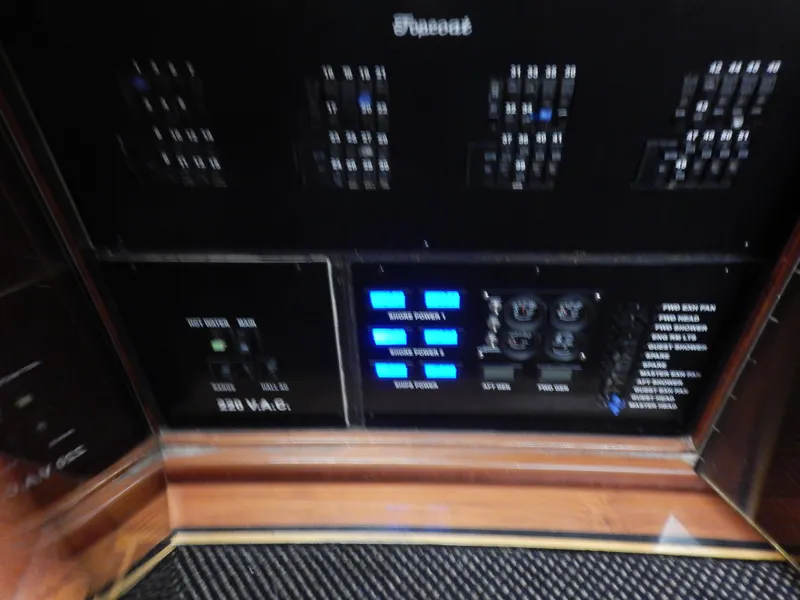 Slide: The Image of Control panel of a 1974 Pacemaker Cockpit Motoryacht with switches and indicators. - 14