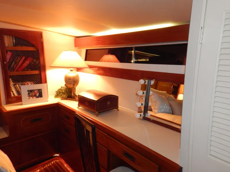 Slide: The Image of 1974 Pacemaker Cockpit Motoryacht interior with wooden desk, lamp, and mirror. - 18