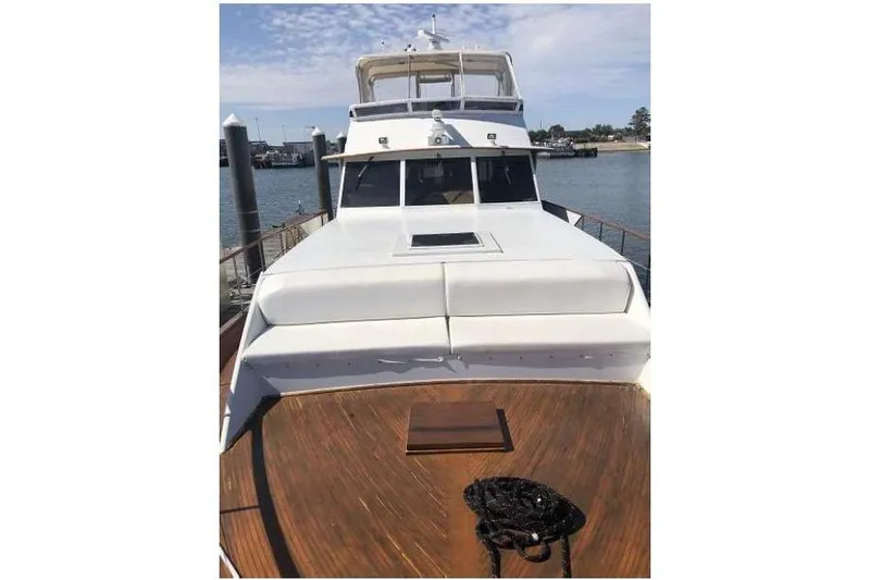 Slide: The Image of 1974 Pacemaker Cockpit Motoryacht on water, showcasing deck and cabin. - 51