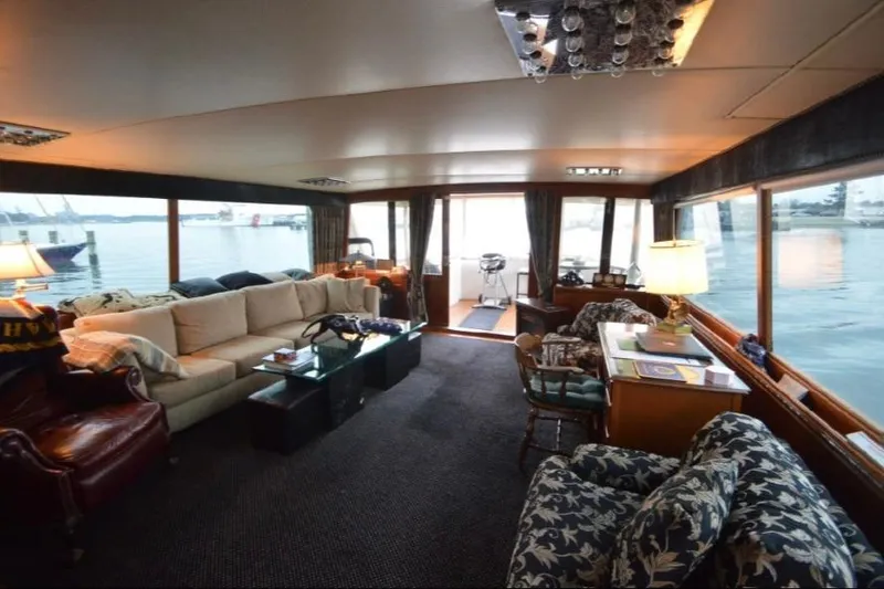 Slide: The Image of Luxurious interior of a 1974 Pacemaker Cockpit Motoryacht with elegant seating and waterfront views. - 57