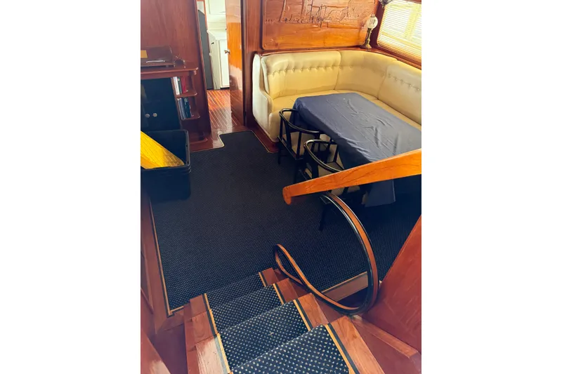 Slide: The Image of Interior of 1974 Pacemaker Cockpit Motoryacht with dining area and wooden accents. - 63
