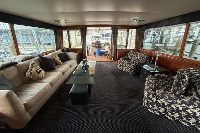 Slide: The Image of Luxurious interior of a 1974 Pacemaker Cockpit Motoryacht with elegant seating and decor. - 64
