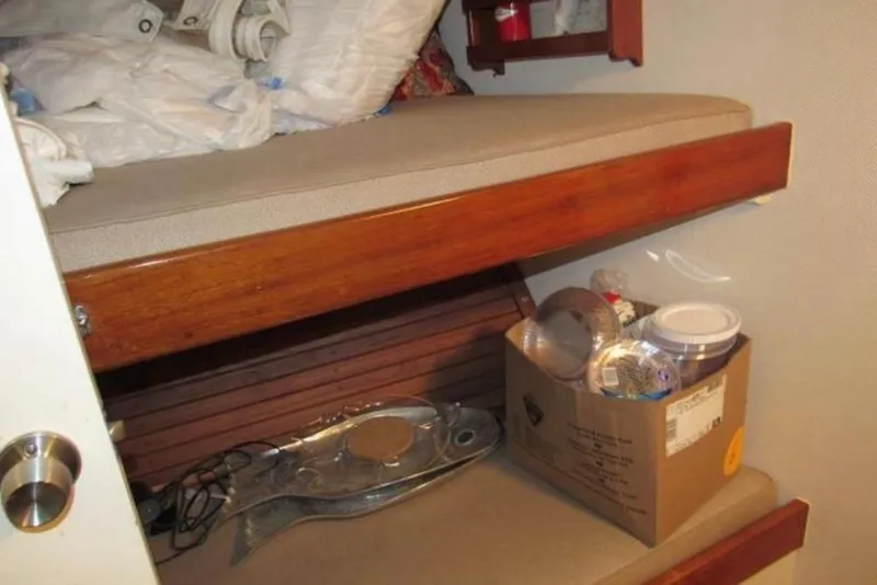 Slide: The Image of 1974 Pacemaker Cockpit Motoryacht interior with bunk bed and storage box. - 66