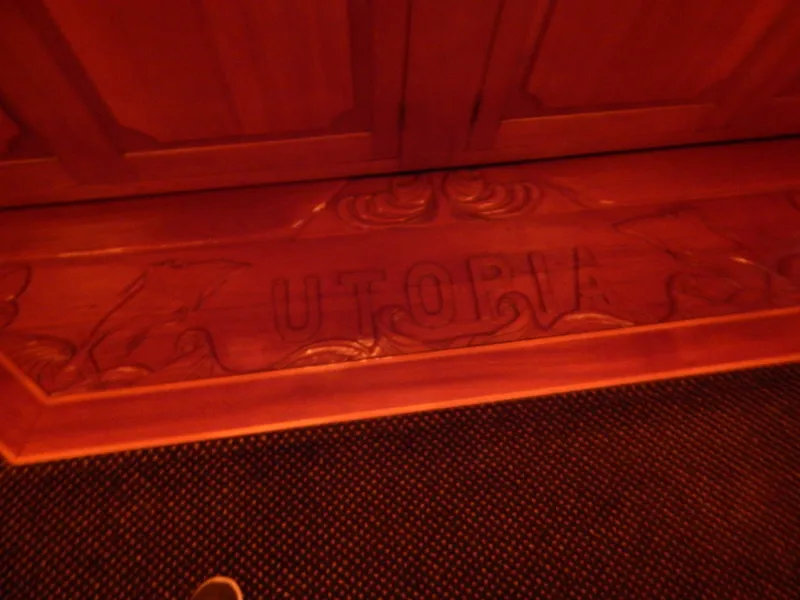 Slide: The Image of Carved wooden panel with "UTOPIA" on a 1974 Pacemaker Cockpit Motoryacht. - 7