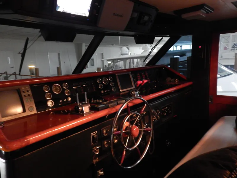 Slide: The Image of 1974 Pacemaker Cockpit Motoryacht interior with classic steering wheel and control panel. - 9