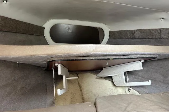 Slide: The Image of Interior cabin of a 2017 Stingray 250 CR boat, featuring storage compartments. - 13