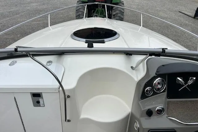 Slide: The Image of 2017 Stingray 250 CR boat dashboard with steering wheel and control panel. - 14