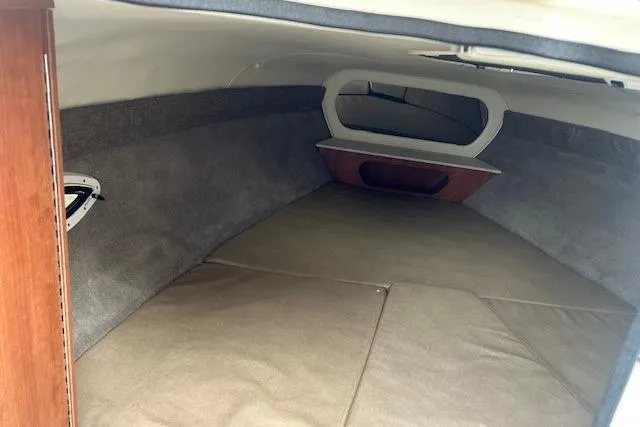 Slide: The Image of 2017 Stingray 250 CR cabin interior with beige upholstery and wooden accents. - 16