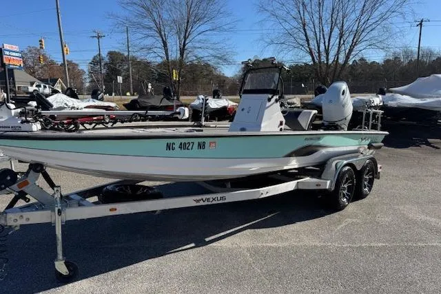The Image of 2023 Vexus AVX1980CC boat on trailer, parked outdoors, clear day. - 1
