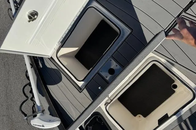 Slide: The Image of 2023 Vexus AVX1980CC boat storage compartments with open lids, showcasing interior space. - 11