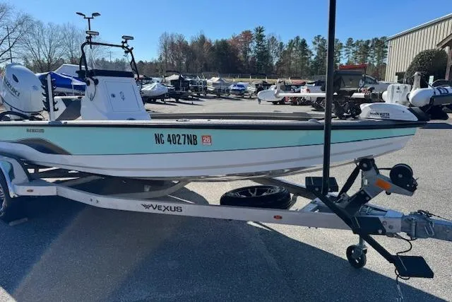 Slide: The Image of 2023 Vexus AVX1980CC boat on trailer in outdoor lot, side view. - 3