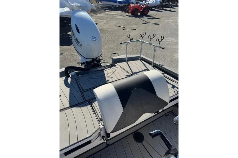 Slide: The Image of 2023 Vexus AVX1980CC boat with Suzuki outboard motor and fishing rod holders. - 8
