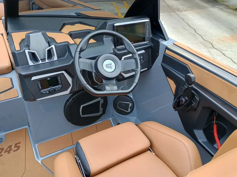 Slide: The Image of 2024 Axis A245 boat interior with modern steering and control panel. - 1