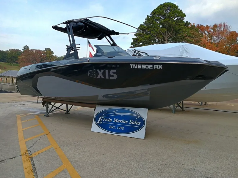 Slide: The Image of 2024 Axis A245 boat displayed at Erwin Marine Sales dealership. - 5