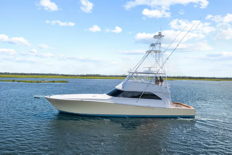 The Image of 2005 Viking 61 Convertible yacht cruising on a sunny day. - 0