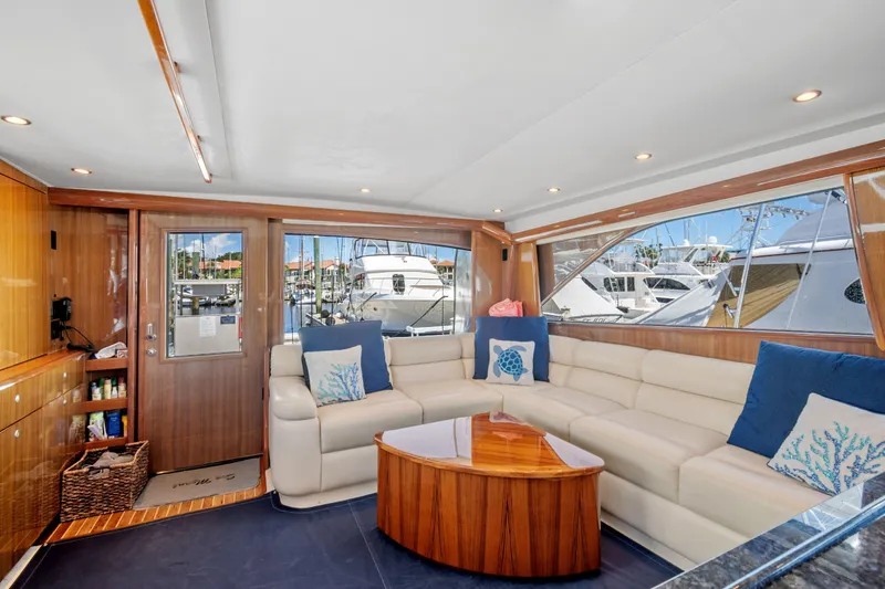 Slide: The Image of Luxurious interior of a 2005 Viking 61 Convertible yacht with plush seating and nautical decor. - 15