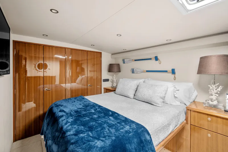 Slide: The Image of Luxurious bedroom interior of 2005 Viking 61 Convertible yacht with elegant decor and cozy bedding. - 18