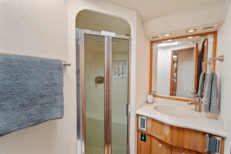 Slide: The Image of Luxurious bathroom in 2005 Viking 61 Convertible yacht with shower and modern amenities. - 23