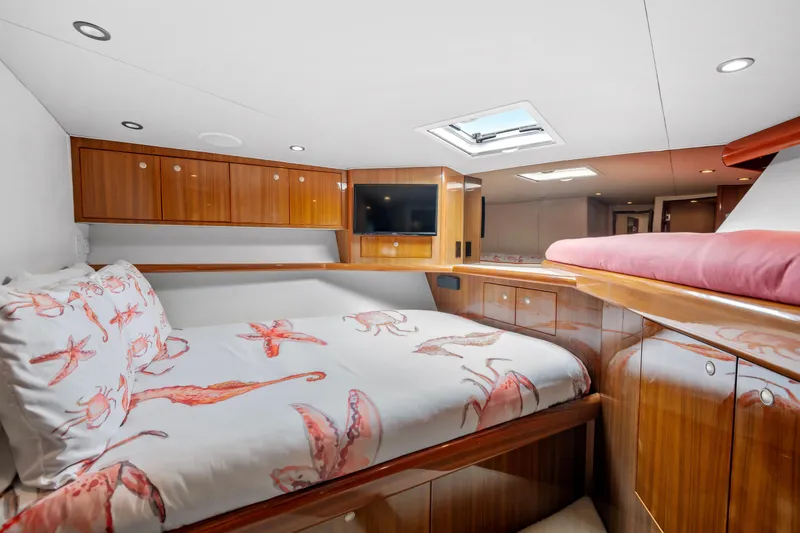 Slide: The Image of Luxurious cabin interior of 2005 Viking 61 Convertible yacht with elegant wood finish. - 24