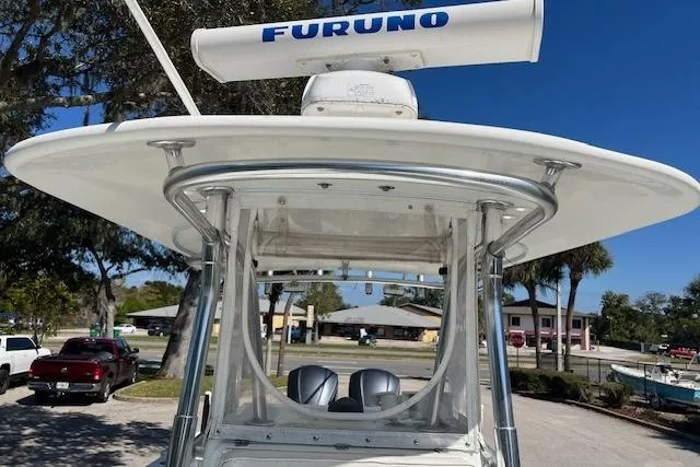 Slide: The Image of 2008 Contender 31 Fisharound boat with Furuno radar, docked under clear blue sky. - 10