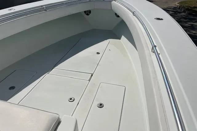 Slide: The Image of 2008 Contender 31 Fisharound boat deck with storage compartments and railings. - 11