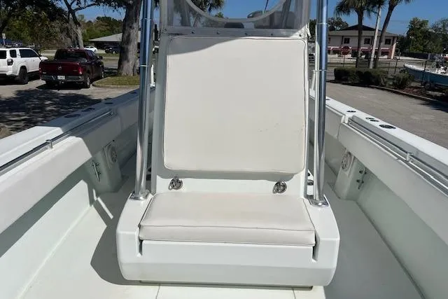Slide: The Image of 2008 Contender 31 Fisharound boat interior with white seating and console. - 13