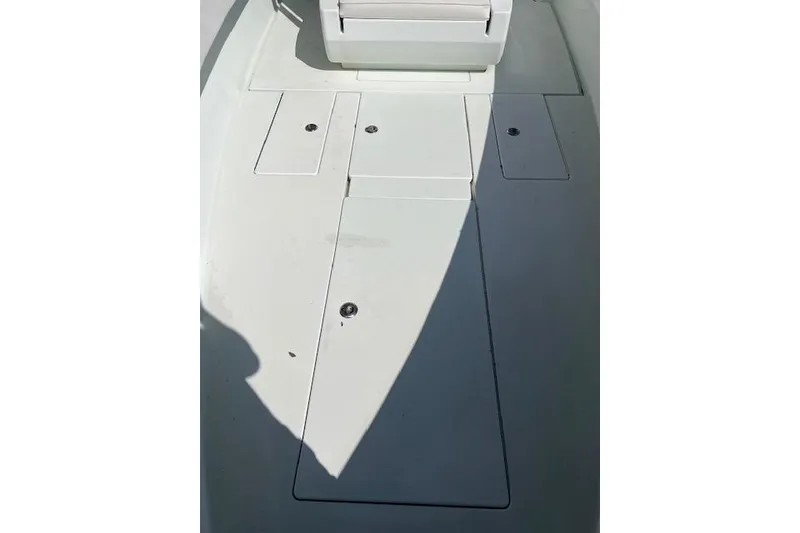Slide: The Image of 2008 Contender 31 Fisharound boat deck with storage compartments. - 14