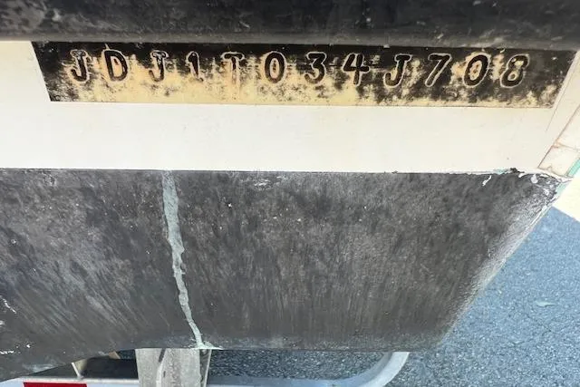 Slide: The Image of 2008 Contender 31 Fisharound boat hull identification number on display. - 15