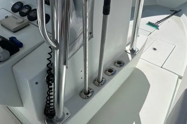 Slide: The Image of 2008 Contender 31 Fisharound boat deck with fishing rod holders and equipment. - 8