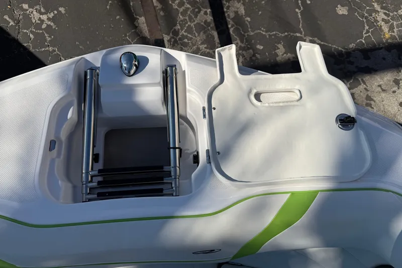 Slide: The Image of 2018 Regal 22 FasDeck boat ladder and storage compartment on deck. - 15