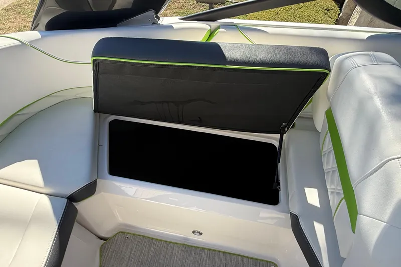 Slide: The Image of 2018 Regal 22 FasDeck boat interior with open storage compartment. - 8