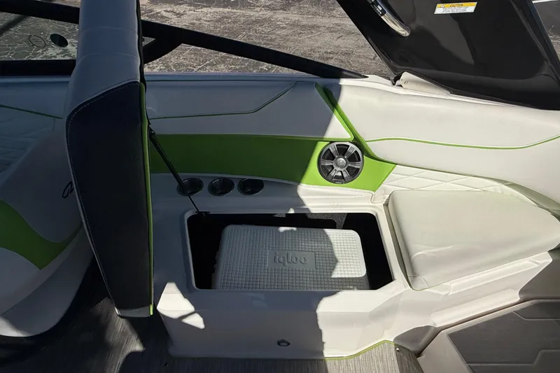 Slide: The Image of 2018 Regal 22 FasDeck boat interior with storage compartment and speaker. - 9