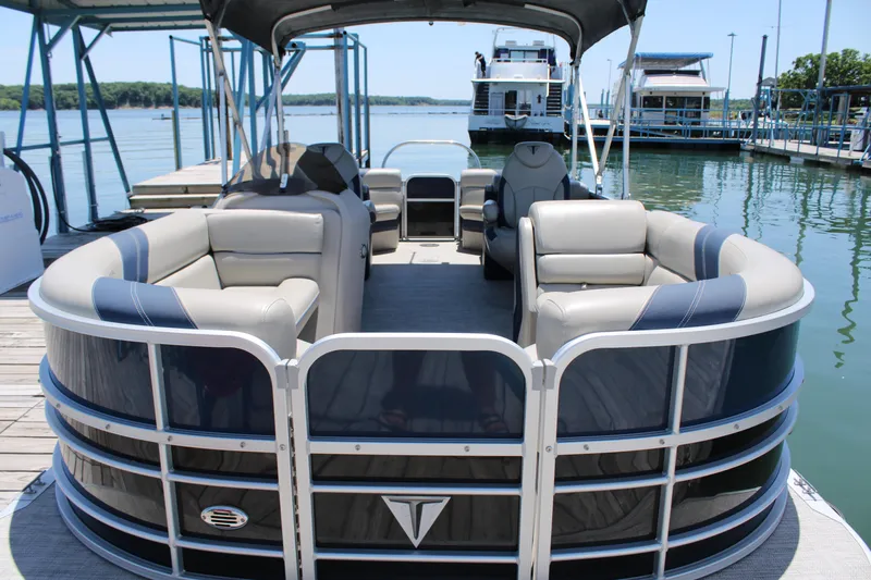 Slide: The Image of 2022 Trifecta RFLE pontoon boat docked, featuring spacious seating and sleek design. - 4