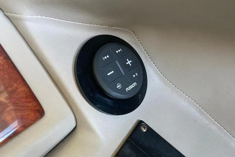 Slide: The Image of Control panel on 2002 Cobalt 282 boat dashboard with Fusion audio system. - 14