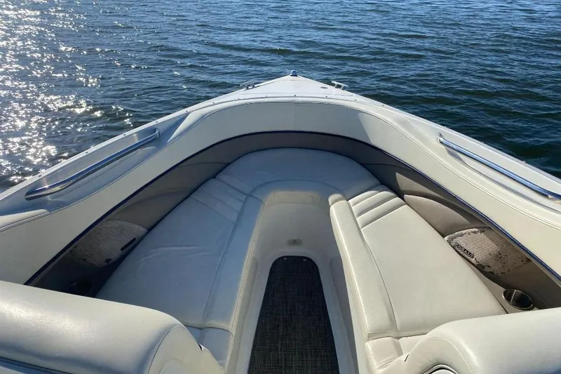 Slide: The Image of Bow seating area of 2002 Cobalt 282 boat on water. - 15