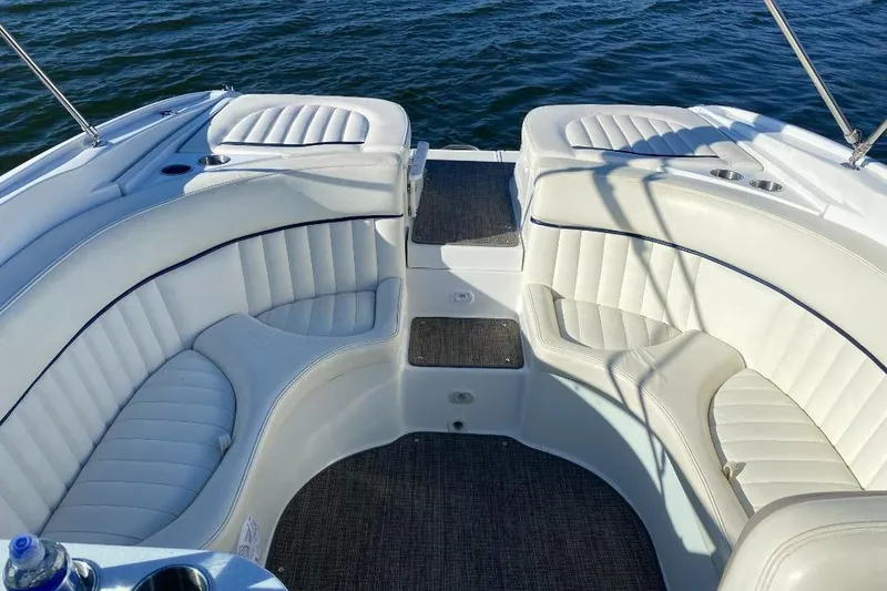 Slide: The Image of Luxurious seating on a 2002 Cobalt 282 boat with white upholstery and ocean backdrop. - 6
